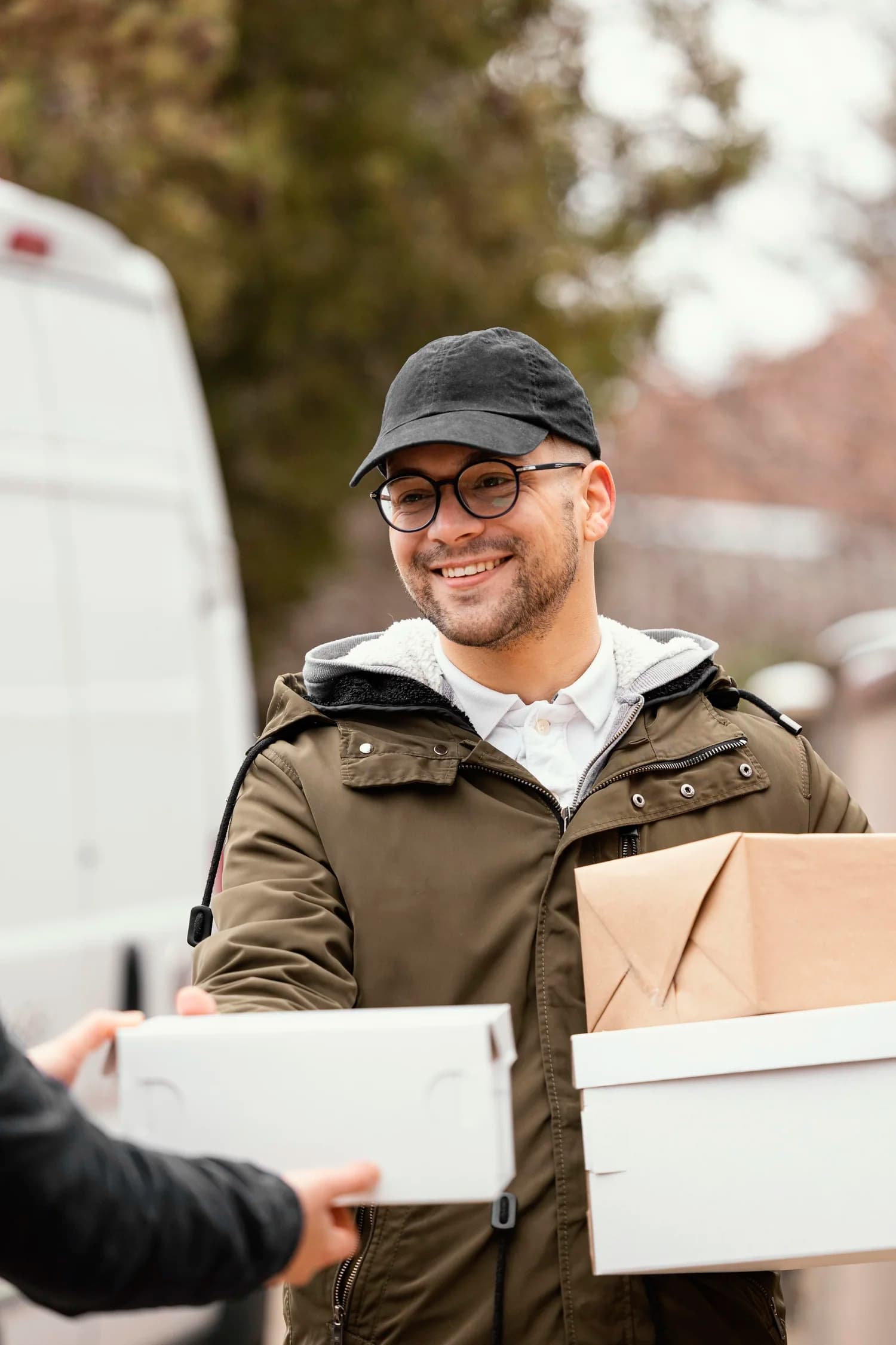 A courier carrying packages for delivery